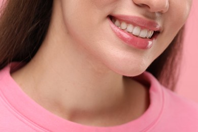 Woman with clean teeth smiling, closeup view