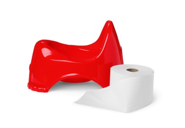 Photo of Red baby potty and toilet paper on white background