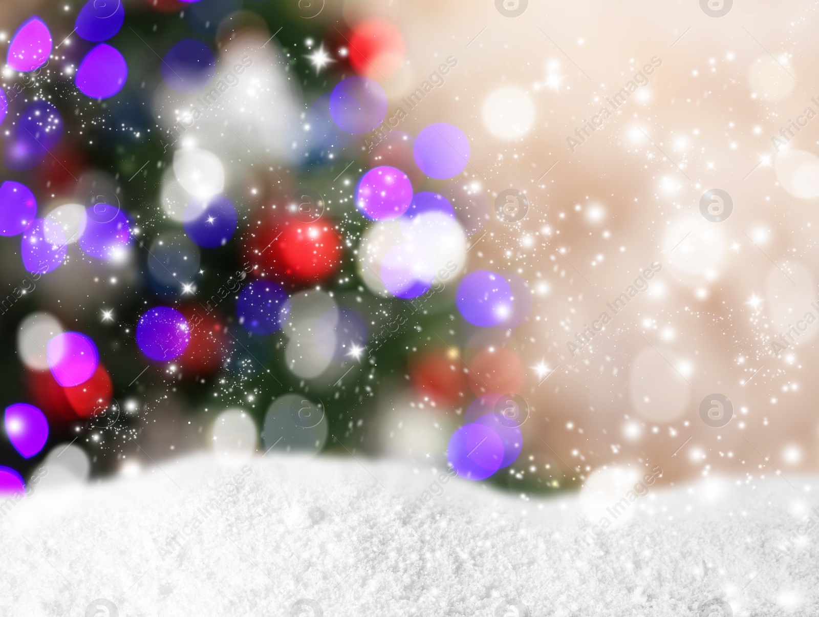 Image of Snow and blurred view of beautiful decorated Christmas tree. Bokeh effect