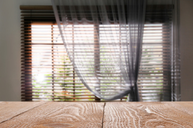 Empty wooden table in room. Space for design