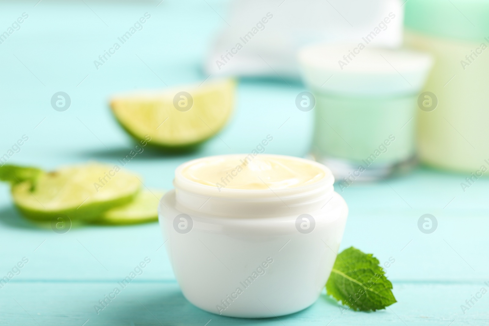 Photo of Jar with cream on wooden background. Hand care cosmetics