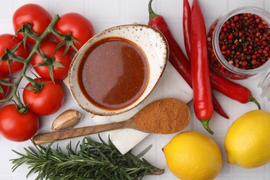 Photo of Flat lay composition with fresh marinade and different ingredients on white tiled table