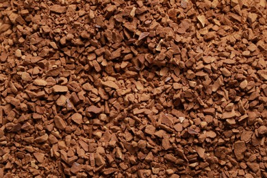 Dry instant coffee as background, top view