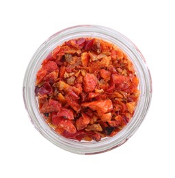 Photo of Aromatic spice. Red chili pepper flakes in jar isolated on white, top view