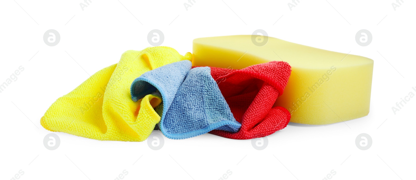 Photo of Sponge and car wash cloths on white background