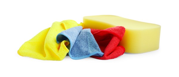 Photo of Sponge and car wash cloths on white background