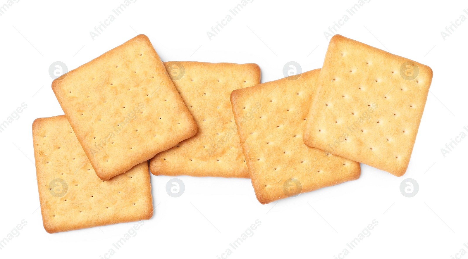 Photo of Many crispy crackers isolated on white, top view. Delicious snack