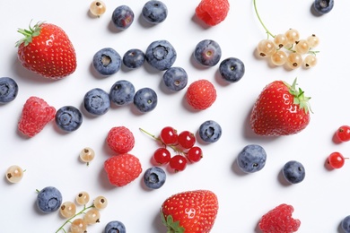 Photo of Raspberries and different berries on white background