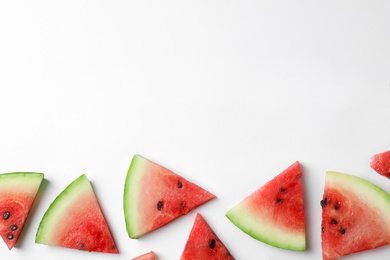 Photo of Slices of ripe watermelon on white background, top view