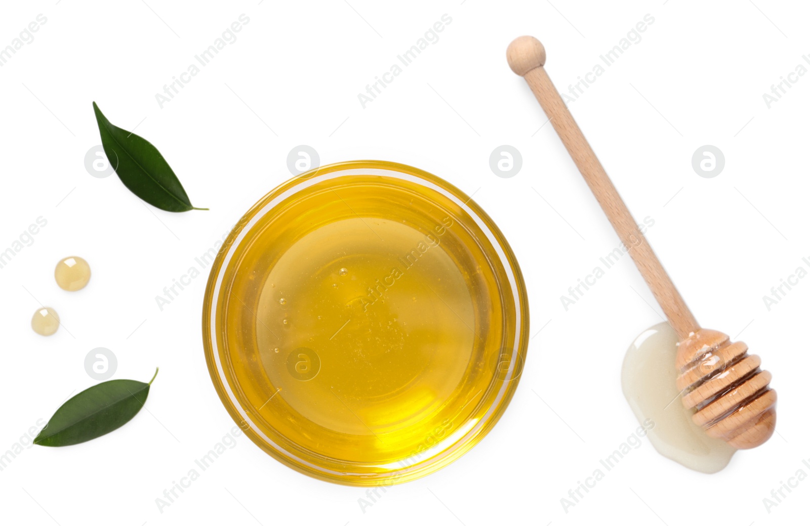 Photo of Tasty honey in bowl, dipper and green leaves on white background, flat lay