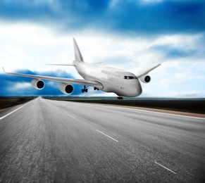 Image of Modern white airplane landing on runway 