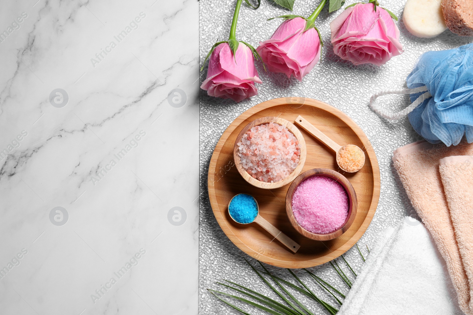 Photo of Flat lay composition with natural sea salt and beautiful roses on white marble table. Space for text