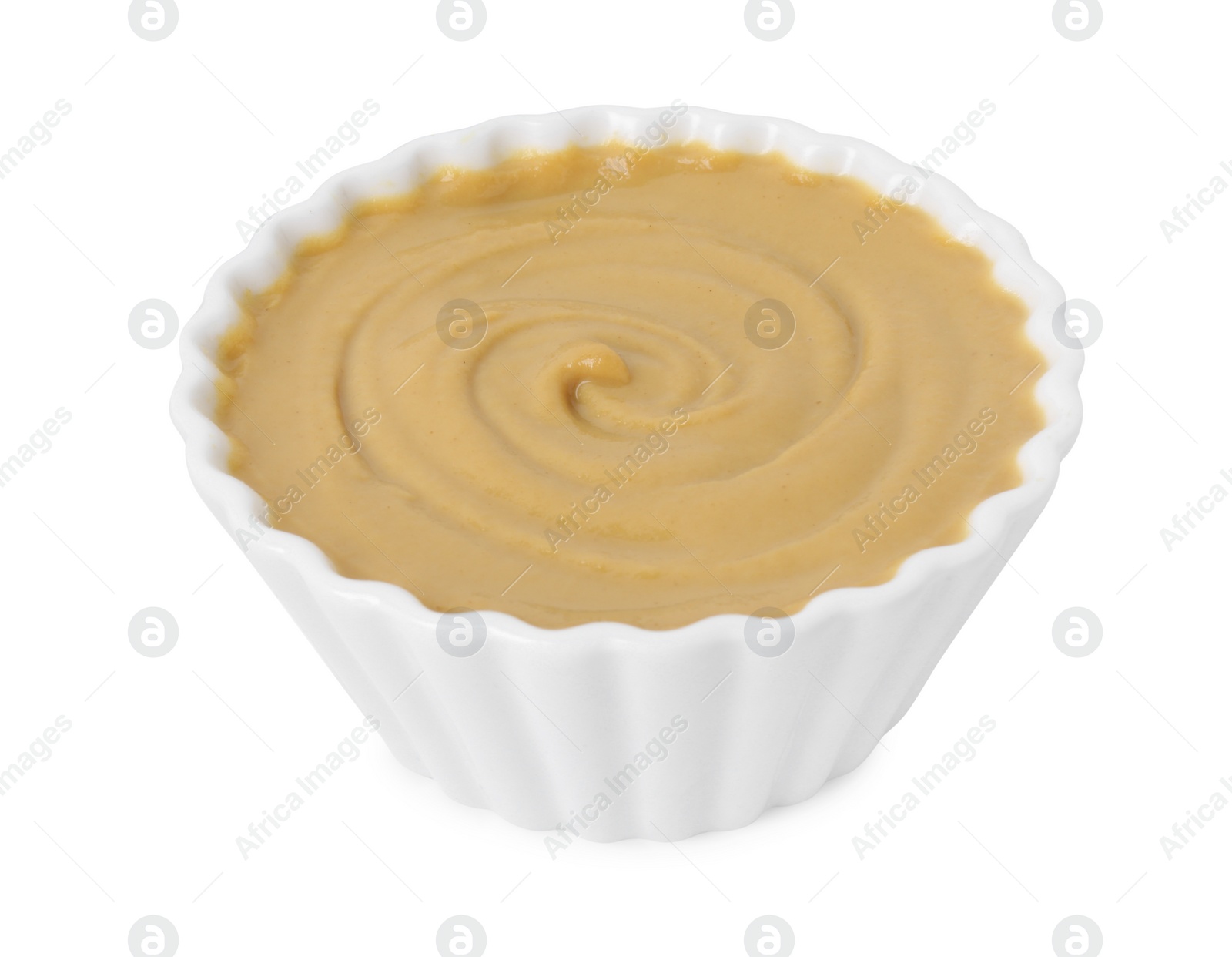 Photo of Fresh tasty mustard sauce in bowl isolated on white