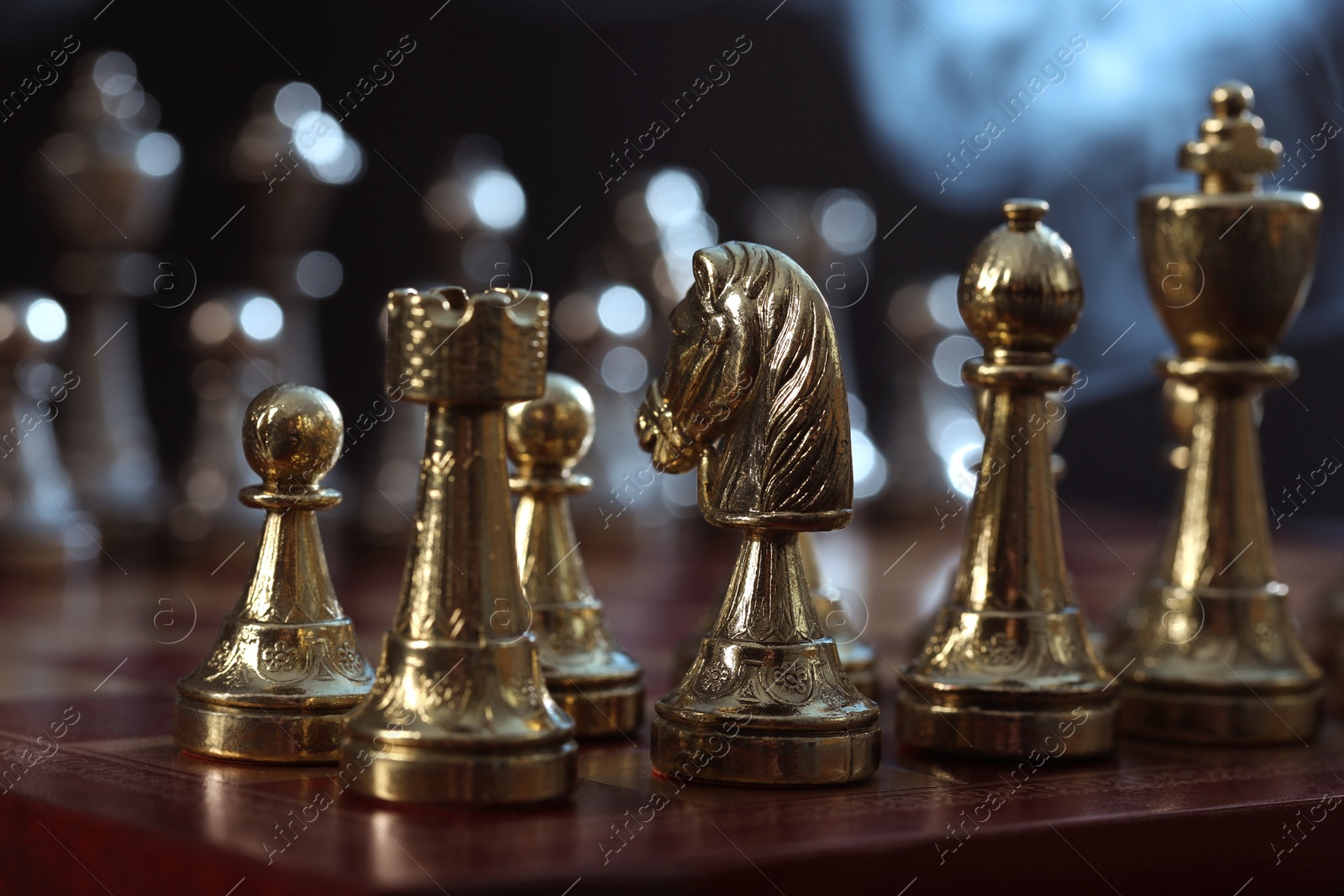 Photo of Chess pieces on checkerboard before game, selective focus