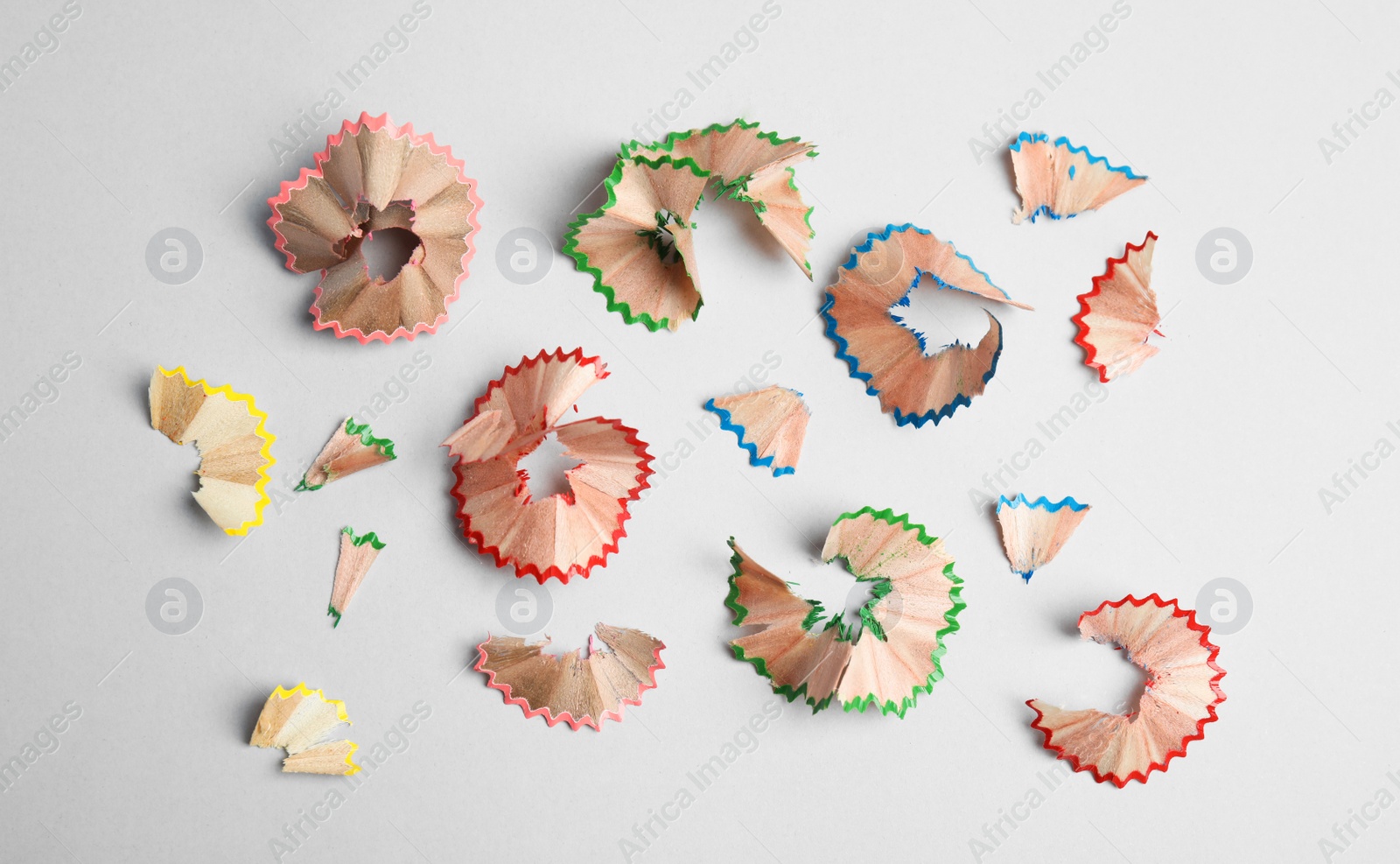 Photo of Pencil shavings on grey background, flat lay