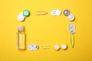Photo of Flat lay composition with contact lenses and accessories on color background