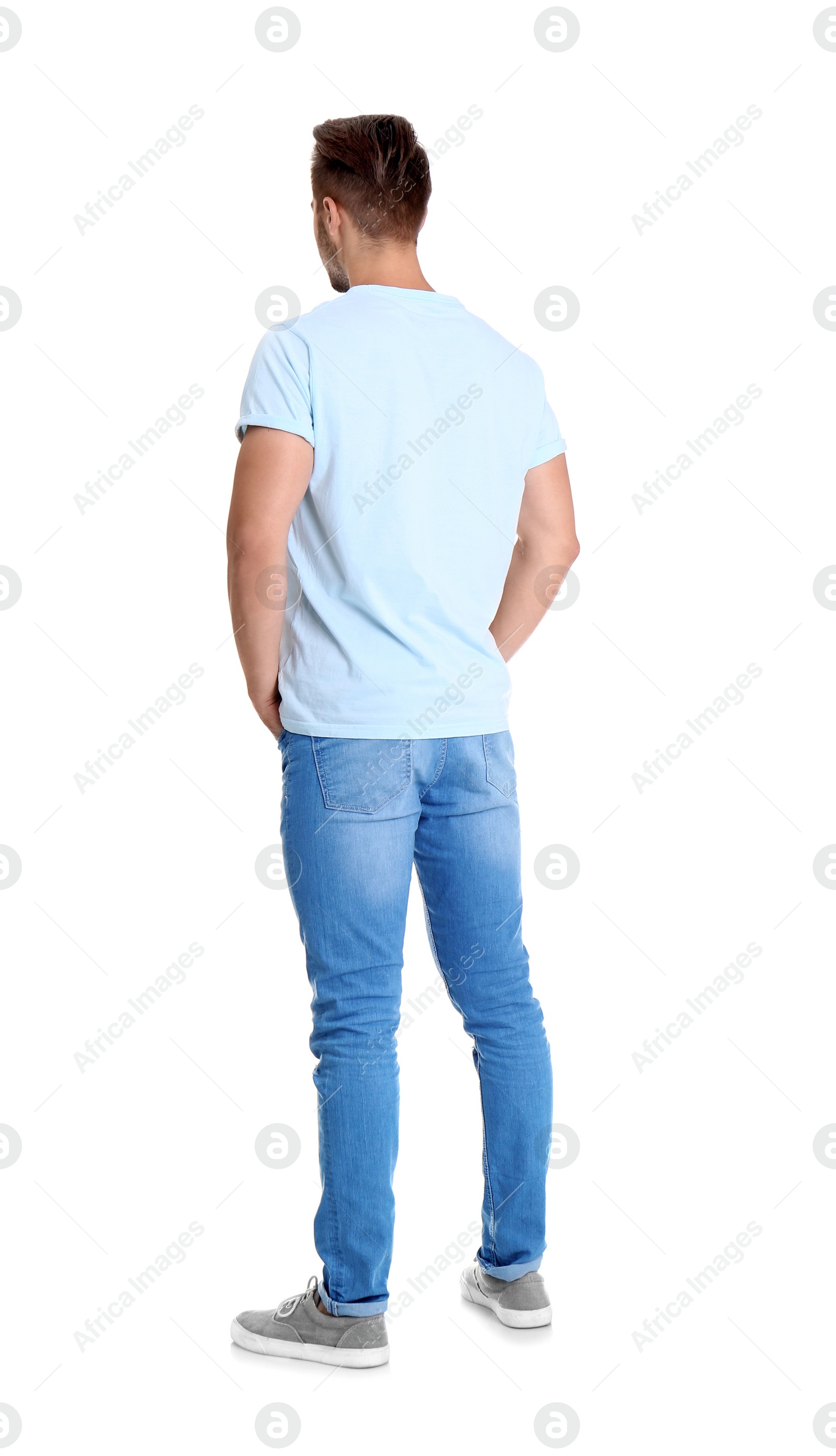 Photo of Young man in stylish jeans on white background