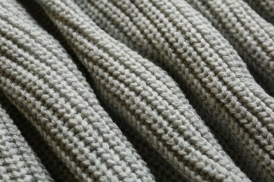 Photo of Beautiful grey knitted fabric as background, closeup