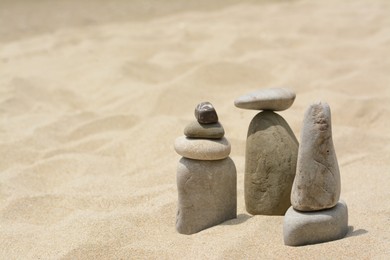 Photo of Stacksstones on beautiful sandy beach, space for text