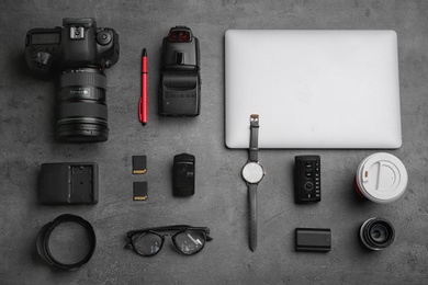 Photo of Flat lay composition with photographer's equipment and accessories on grey background