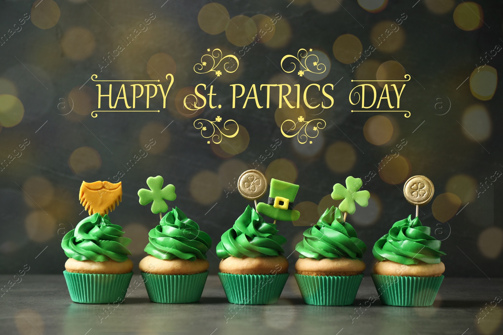 Image of Delicious decorated cupcakes on grey table. St. Patrick's Day celebration