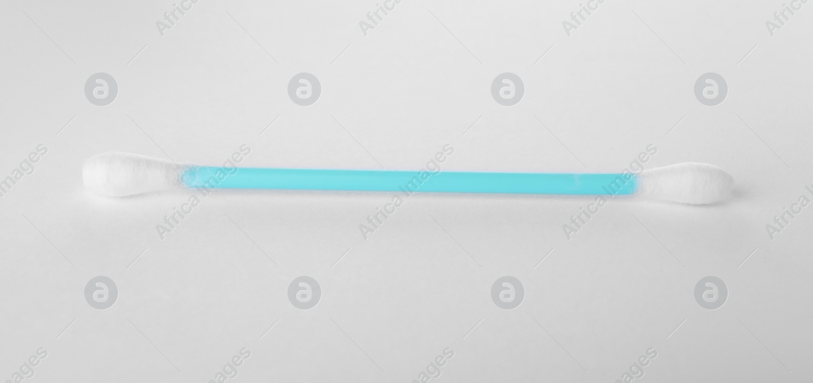 Photo of Clean cotton bud isolated on white. Hygienic accessory