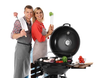 Happy couple cooking on barbecue grill, white background