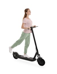 Happy woman riding modern electric kick scooter on white background