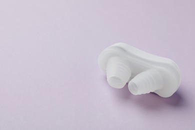 Photo of Nasal anti-snoring device on light background. Space for text