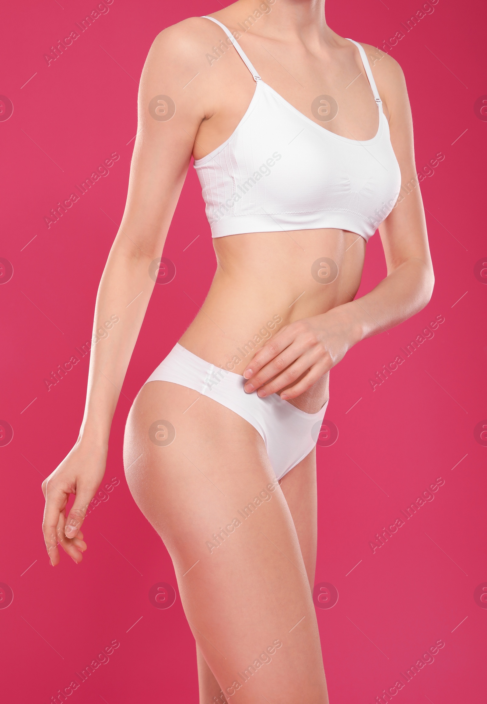 Photo of Slim young woman with smooth skin on color background. Beauty and body care concept