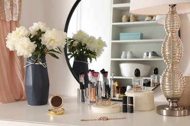 Stylish dressing table in modern wardrobe room