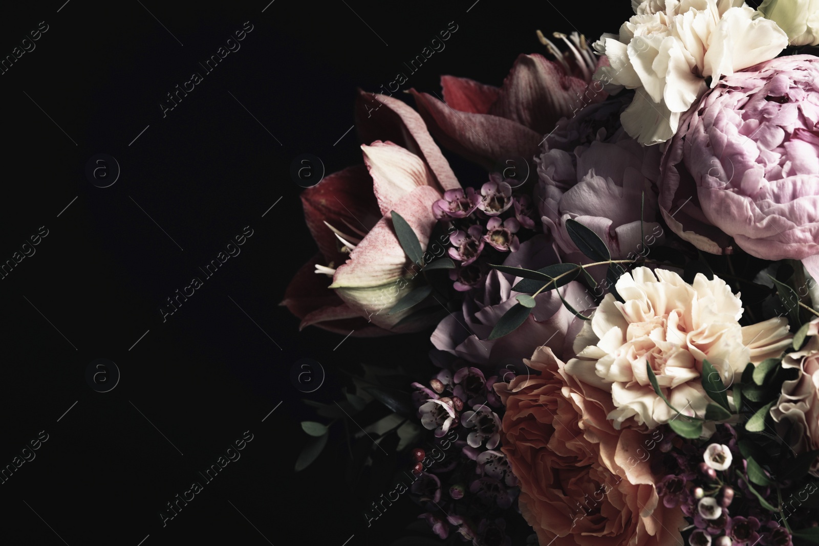 Photo of Beautiful bouquet of different flowers on black background, space for text. Floral card design with dark vintage effect