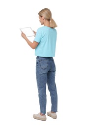 Woman holding tablet with blank screen on white background