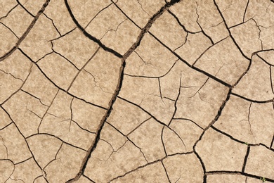 Cracked ground surface as background, top view