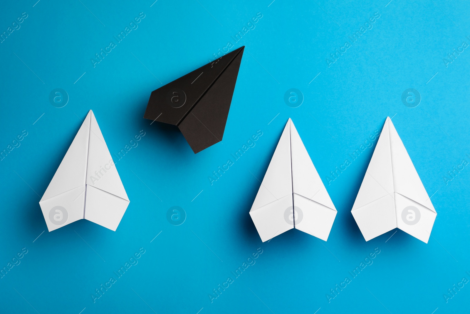 Photo of Flat lay composition with paper planes on light blue background
