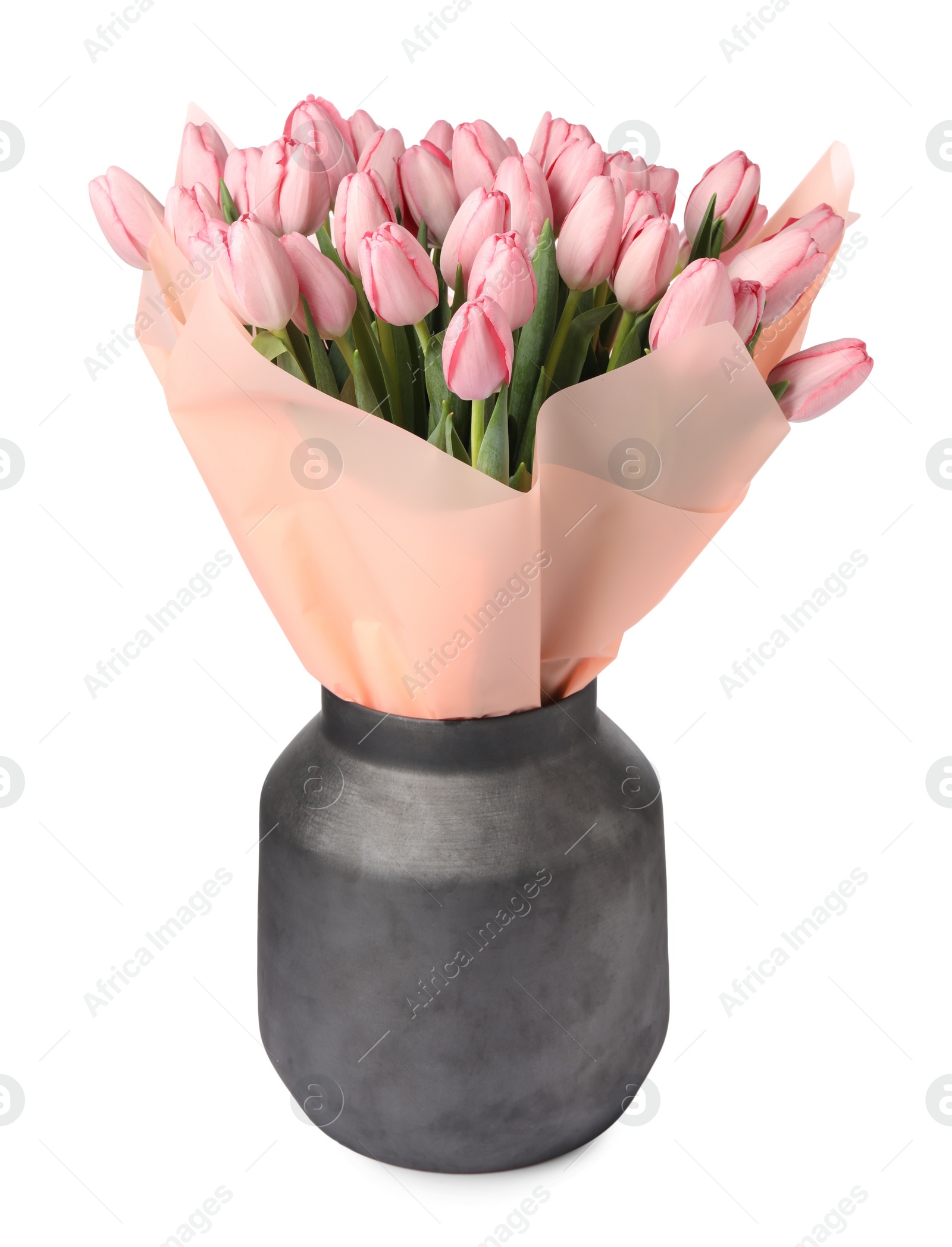 Photo of Bouquet of beautiful pink tulips in vase isolated on white