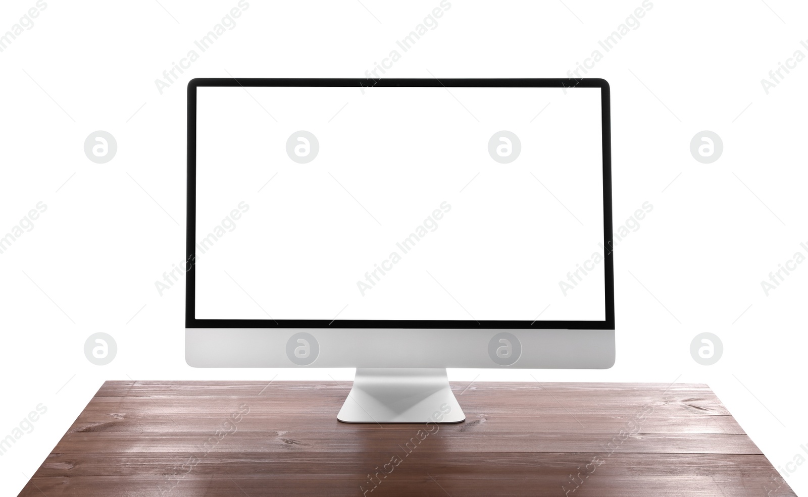 Photo of Modern computer monitor with blank screen on wooden table against white background