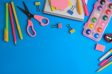 Photo of Flat lay composition with notebook and other school stationery on light blue background, space for text. Back to school
