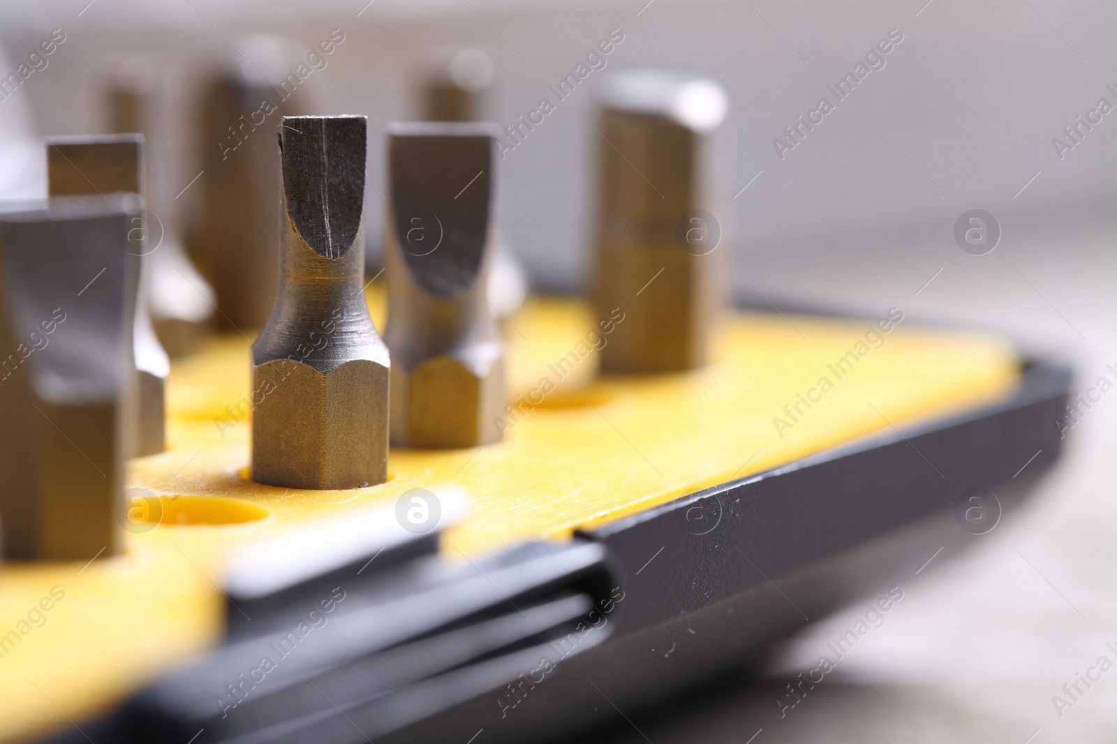 Photo of Screwdriver bit set on blurred background, closeup