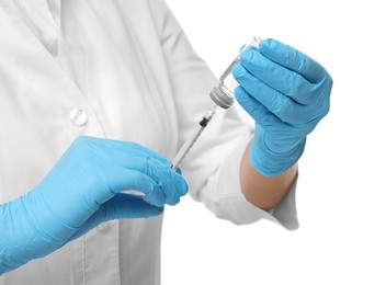 Photo of Doctor filling syringe with medication from glass vial on white background, closeup