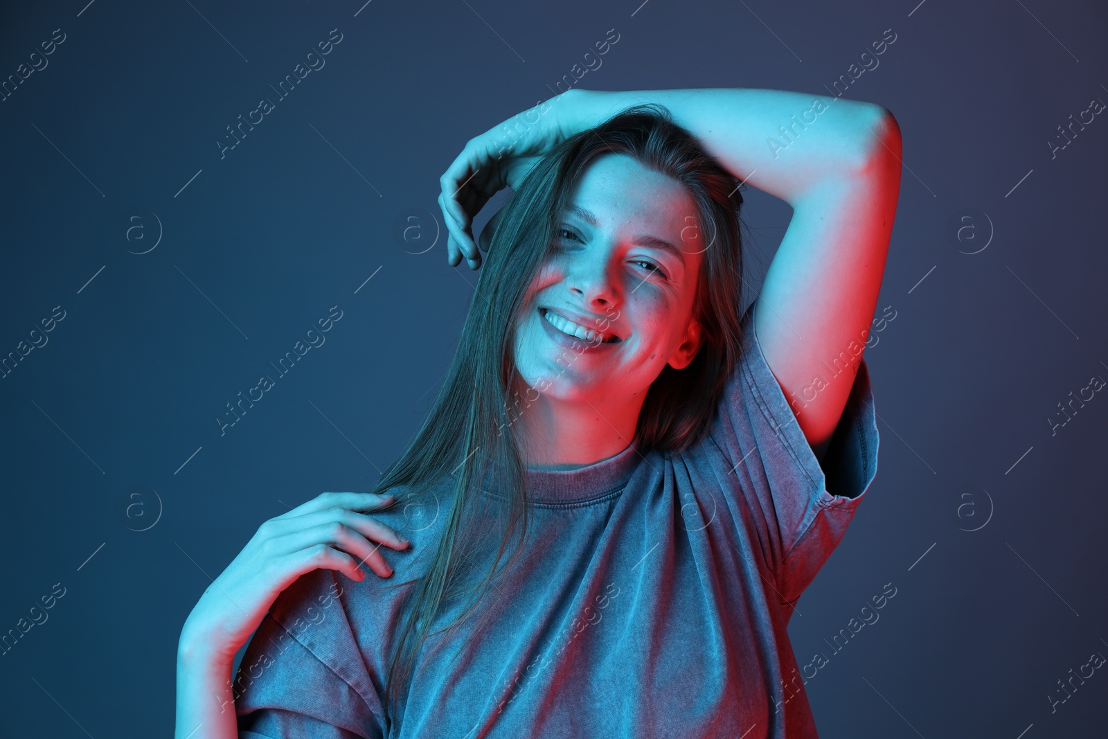 Photo of Portrait of beautiful young woman on color background