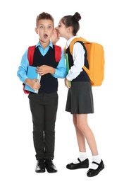 Children in school uniform gossiping on white background