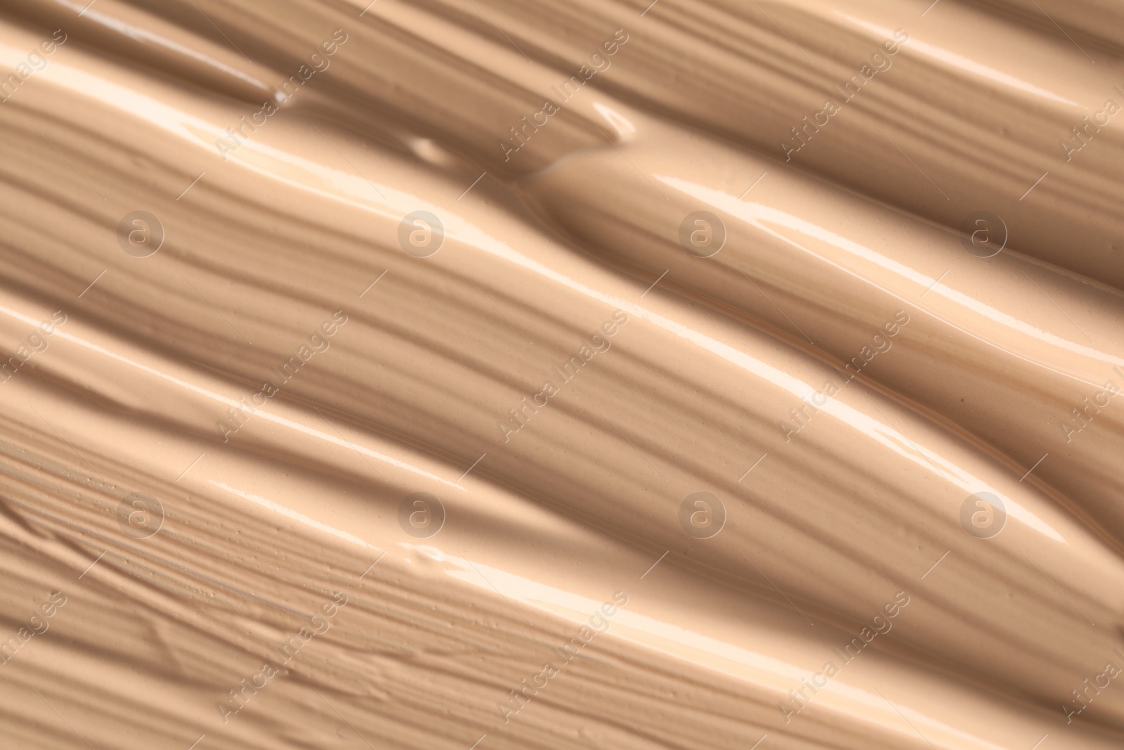 Photo of Texture of liquid skin foundation as background, closeup