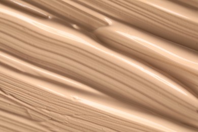 Texture of liquid skin foundation as background, closeup