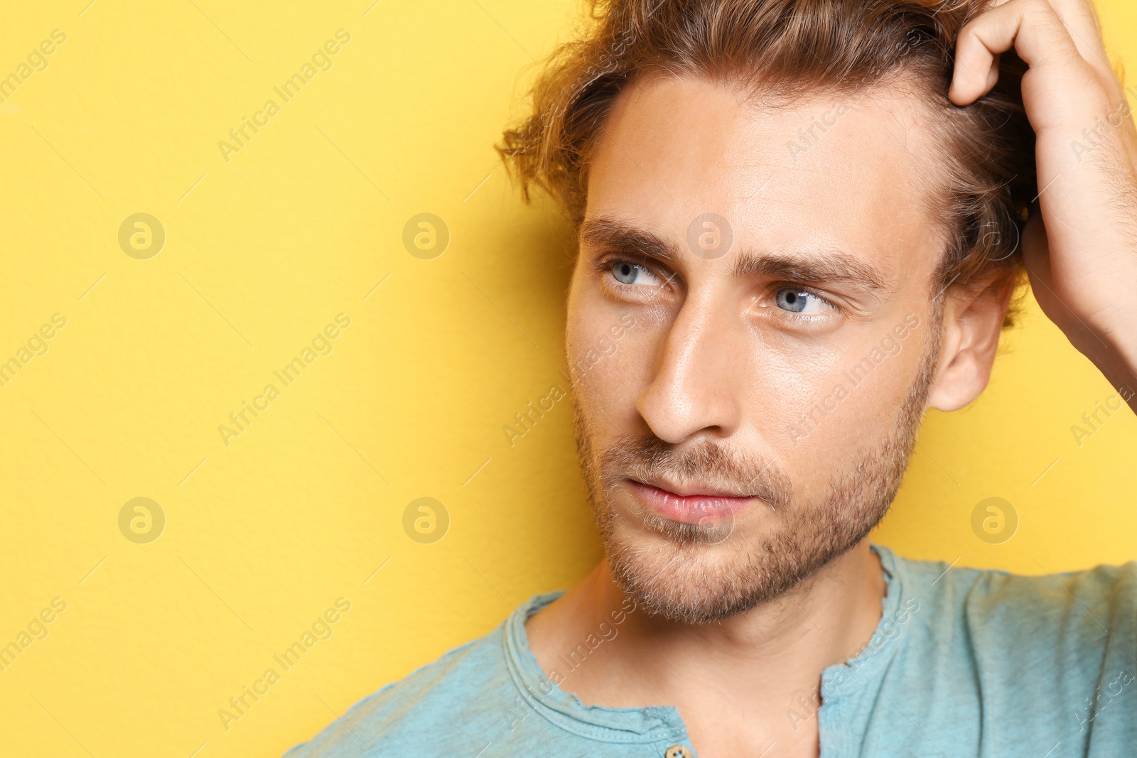 Photo of Portrait of young man on color background