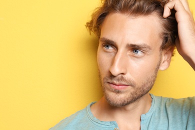 Photo of Portrait of young man on color background