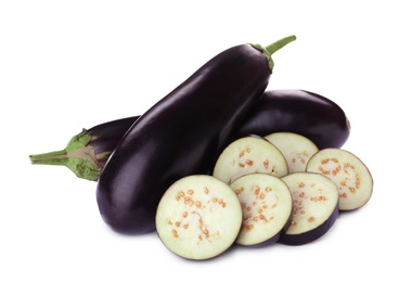Photo of Cut and whole fresh ripe eggplants isolated on white