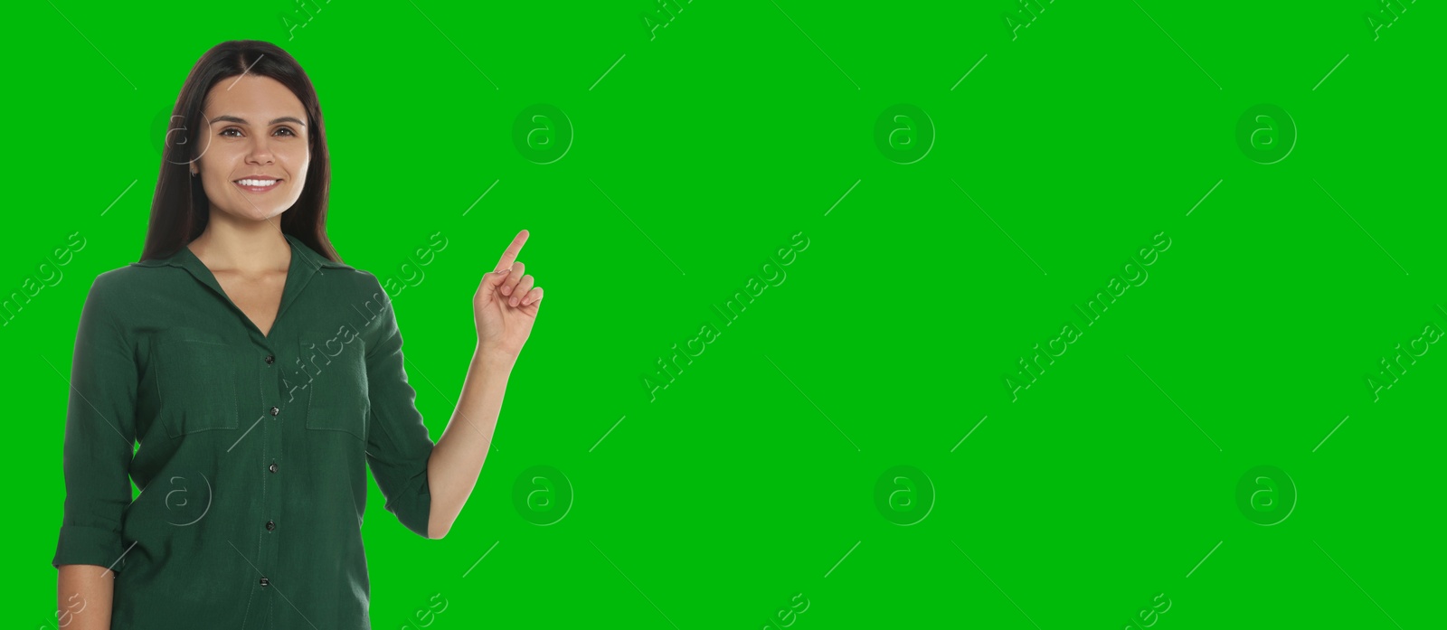 Image of Chroma key compositing. Broadcaster against green screen, banner design