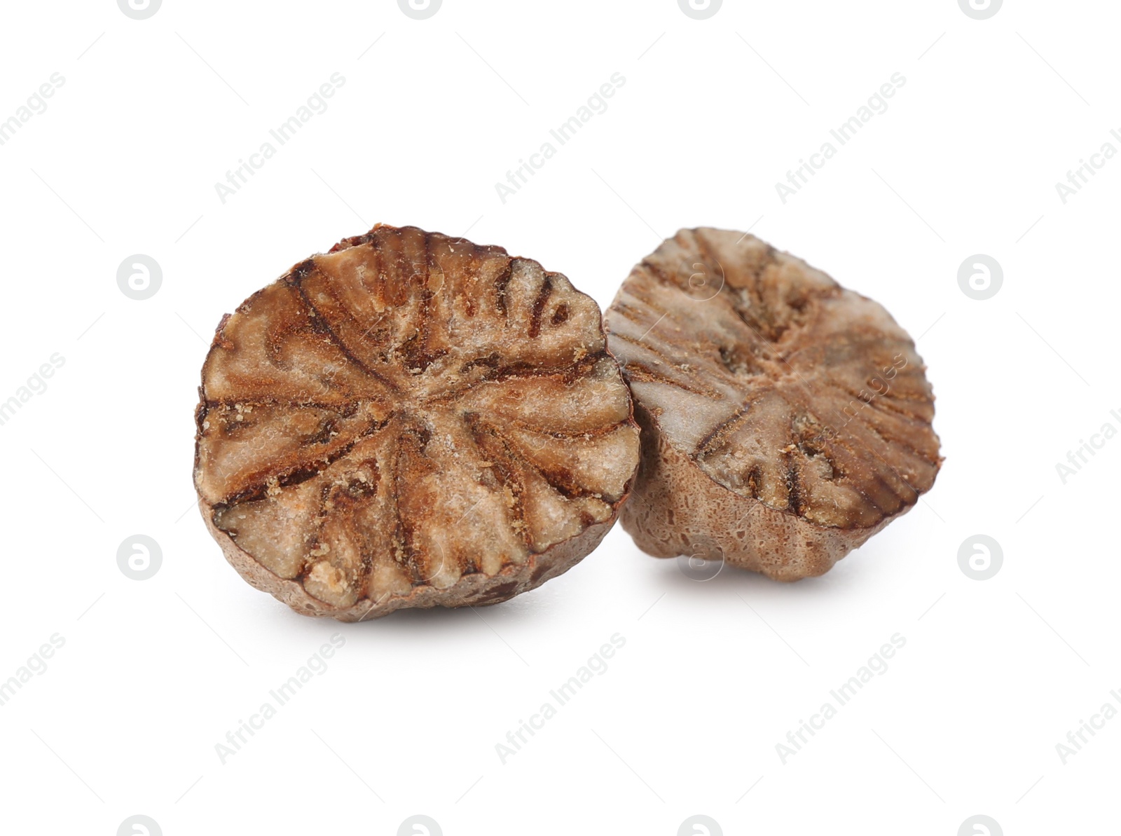 Photo of Pieces of nutmeg seed isolated on white