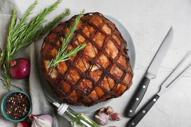 Photo of Delicious baked ham served on light grey table, flat lay